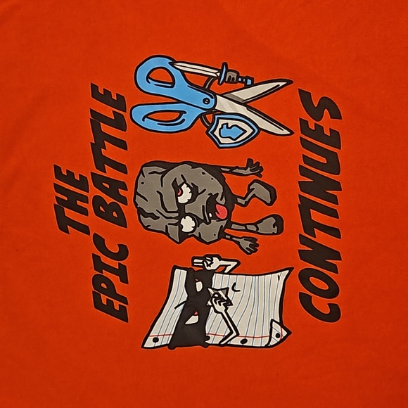 The Epic Battle Continues Rock Paper Scissors orange graphic tee XL (18-20) - Picture 2 of 5